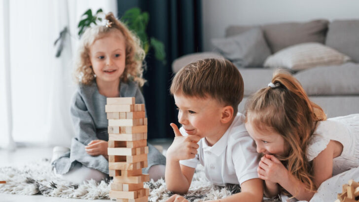 playing-wooden-tower-game-group-children-is-together-home-daytime-728x409.jpg